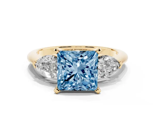 Fancy Blue Three-Stone Princess Cut Diamond Ring with Pear Side Stones and Four-Prong Setting Yellow gold