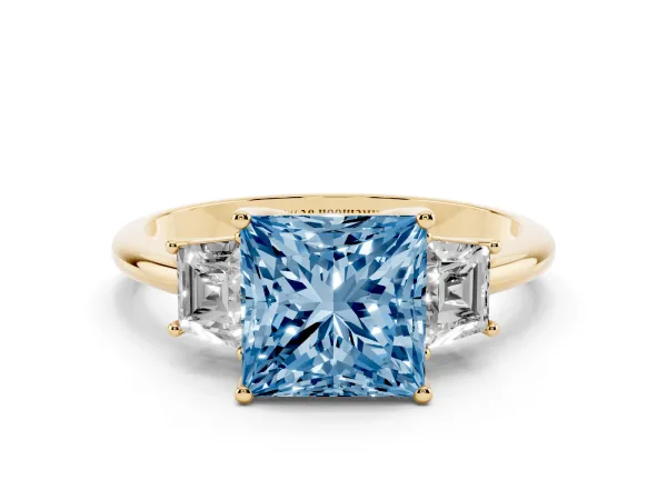 Fancy Blue Princess Cut Diamond Three-Stone Ring with Trapezoid Side Stones and Prong Setting Yellow gold