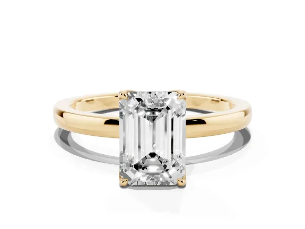 Emerald Cut Diamond Solitaire Ring with Thin Band and Prong Setting Yellow gold