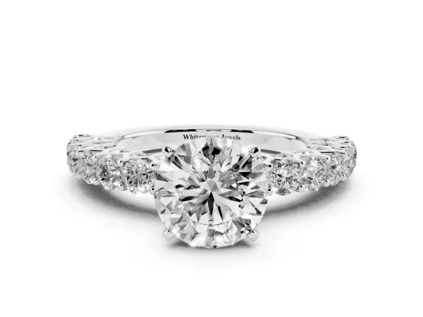 Round Cut Diamond Solitaire Ring with Shared Prong Pavé Band and Four-Prong Setting White gold