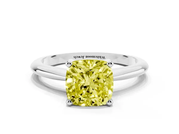 Fancy Yellow Cushion Cut Cut Solitaire Ring with Four-Prong Setting on a Classic Band Platinum