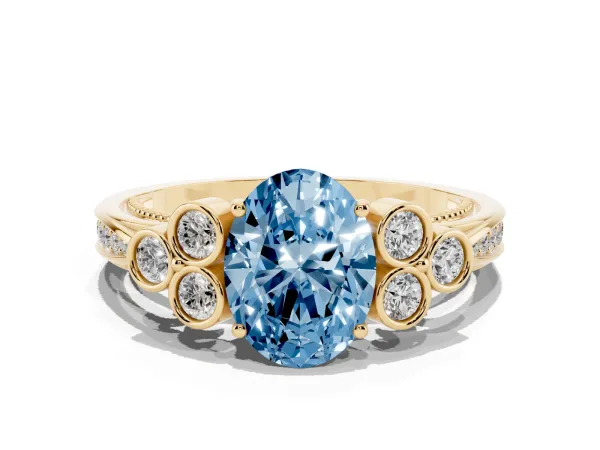 Fancy Blue Oval Cut Cut Diamond Engagement Ring with Bezel Set Round Side Stones and Prong Setting Yellow gold