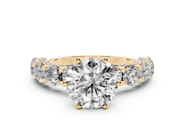 Round Cut Diamond Side Stone Engagement Ring with Four-Prong Setting Yellow gold