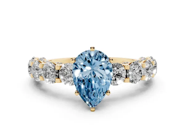 Fancy Blue Pear Cut Diamond Side Stone Engagement Ring with Four-Prong Setting Yellow gold