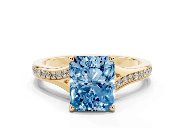 Fancy Blue Radiant Cut Diamond Solitaire Ring with Pavé Band and Prong Setting Yellow gold