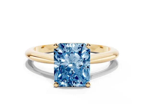 Fancy Blue Radiant Cut Cut Solitaire Ring with Four-Prong Setting on a Classic Band Yellow gold