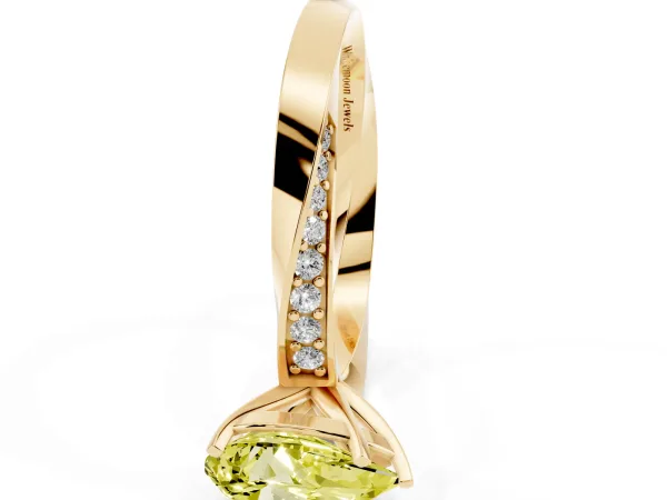Fancy Yellow Pear Cut Diamond Engagement Ring with Side Stone Accents and Four-Prong Setting Yellow gold