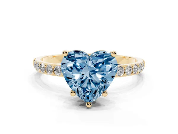 Fancy Blue Heart Cut Diamond Solitaire Ring with Round Pavé Shoulders and Prong Setting Yellow gold