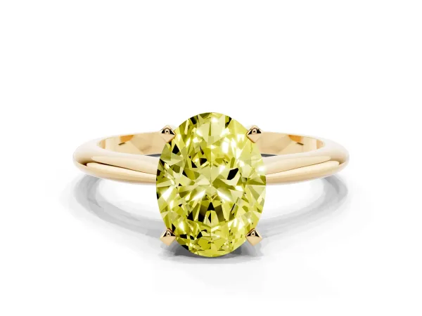 Fancy Yellow Oval Cut Cut Solitaire Ring with Four-Prong Setting on a Classic Band Yellow gold