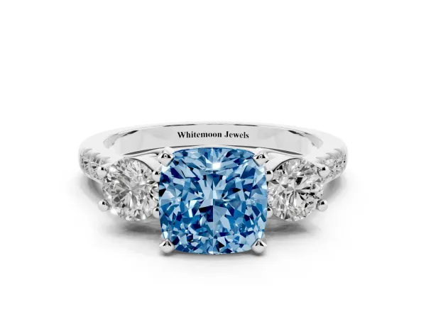 Fancy Blue Three-Stone Cushion Cut Diamond Pavé Band with Four-Prong Setting Platinum
