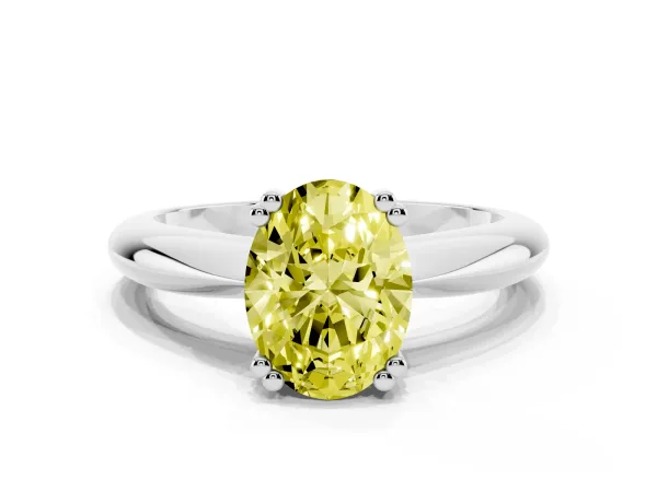 Fancy Yellow Oval Cut Cut Solitaire Engagement Ring with Tapered Band and Four-Prong Setting White gold