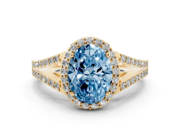 Fancy Blue Oval Cut Halo Split Shank Pave Diamond Ring with Four-Prong Setting Yellow gold