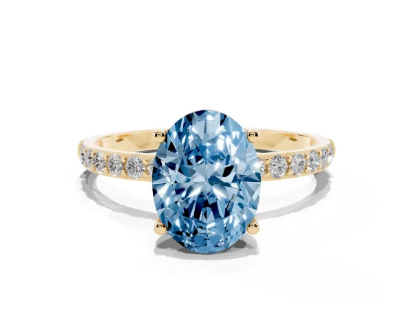 Fancy Blue Oval Cut Diamond Solitaire Ring with Round Pavé Shoulders and Prong Setting Yellow gold