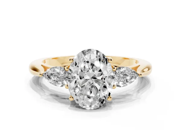 Three-Stone Oval Cut Brilliant Diamond Solitaire Ring with Tapered Band and Four-Prong Setting Yellow gold