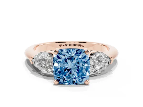 Fancy Blue Three-Stone Cushion Cut Diamond Ring with Pear Side Stones and Four-Prong Setting Rose gold