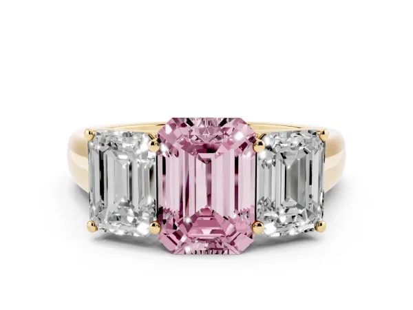 Fancy Pink Emerald Cut Three-Stone Diamond Ring with Prong Setting on a Classic Band Yellow gold