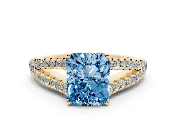 Fancy Blue Radiant Cut Diamond Split Shank Pavé Engagement Ring with Four-Prong Setting Yellow gold