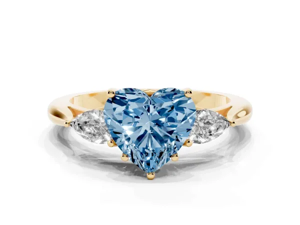 Fancy Blue Three-Stone Heart Cut Diamond Ring with Pear Side Stones in Four-Prong Setting Yellow gold
