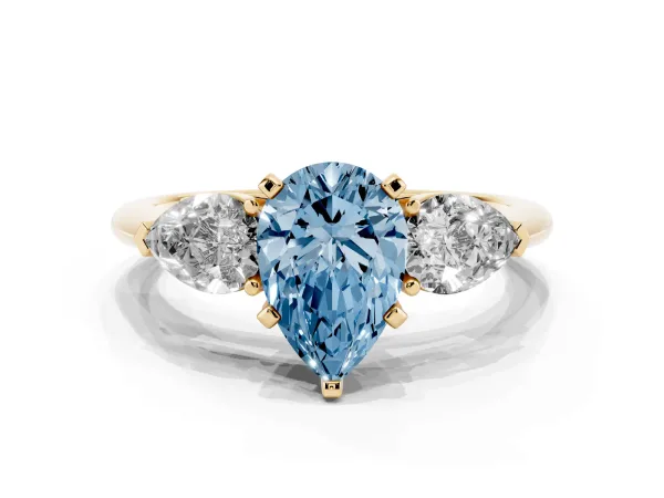Fancy Blue Three-Stone Pear Cut Diamond Ring with Pear Side Stones and Four-Prong Setting Yellow gold