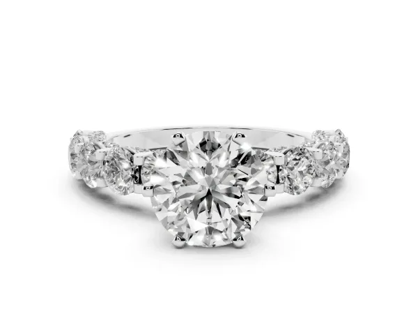Round Cut Diamond Side Stone Engagement Ring with Four-Prong Setting Platinum