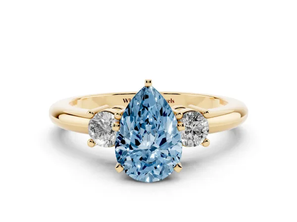 Fancy Blue Three-Stone Pear Cut Cut Diamond Solitaire with Prong Setting and Classic Band Yellow gold