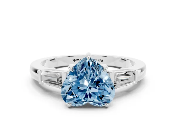 Fancy Blue Heart Cut Diamond Three-Stone Ring with Tapered Baguette Side Stones and Prong Setting White gold