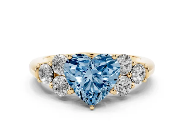 Fancy Blue Heart Cut Cut Diamond Cluster Ring with Round Accent Stones and Prong Setting on a Classic Band Yellow gold