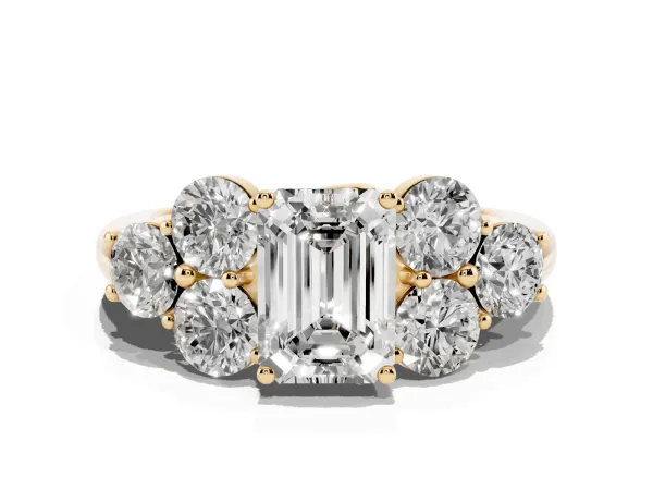 Emerald Cut Cut Diamond Cluster Ring with Round Accent Stones and Prong Setting on a Classic Band Yellow gold