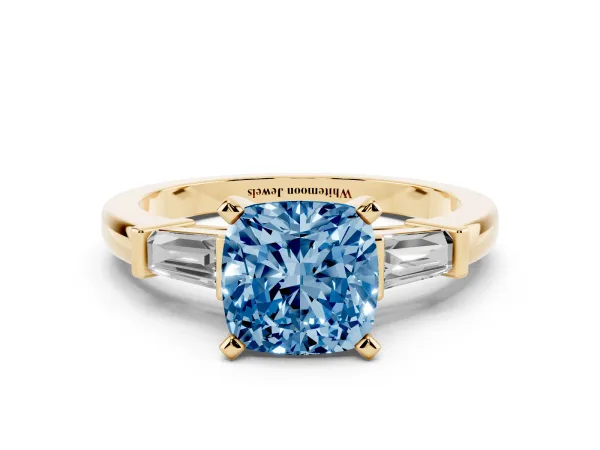 Fancy Blue Cushion Cut Cut Diamond Solitaire Ring with Tapered Baguette Accents and Four-Prong Setting Yellow gold
