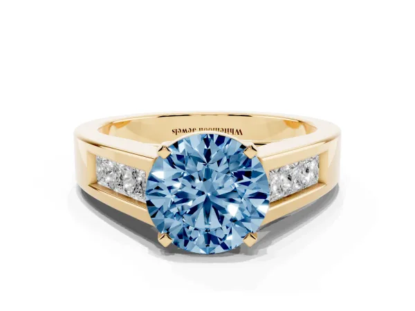 Fancy Blue Round Cut Cut Channel Set Solitaire Ring with Four-Prong Setting Yellow gold