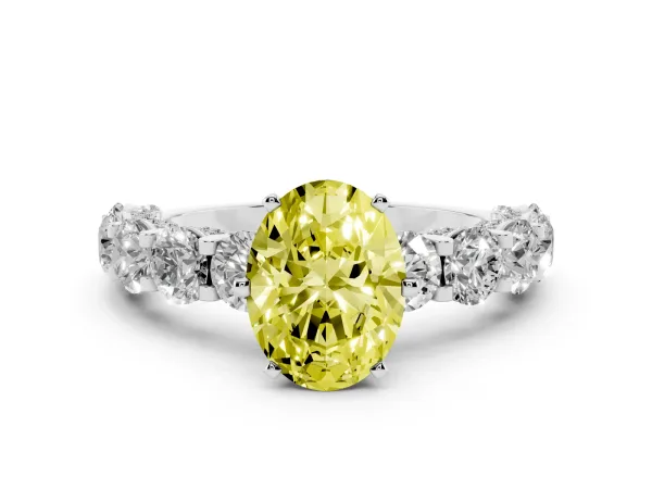 Fancy Yellow Oval Cut Diamond Side Stone Engagement Ring with Four-Prong Setting White gold