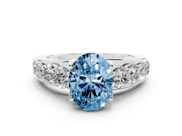Fancy Blue Oval Cut Diamond Engagement Ring with Pavé Band and Four-Prong Setting Platinum