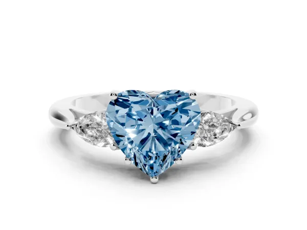 Fancy Blue Three-Stone Heart Cut Brilliant Diamond Solitaire Ring with Tapered Band and Four-Prong Setting Platinum
