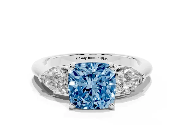 Fancy Blue Three-Stone Cushion Cut Diamond Ring with Pear Side Stones and Four-Prong Setting White gold