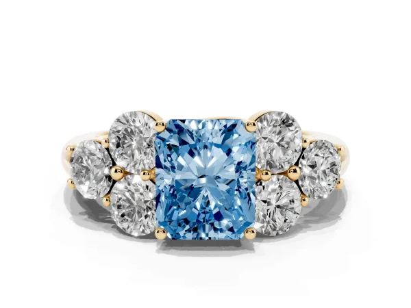 Fancy Blue Radiant Cut Cut Diamond Cluster Ring with Round Accent Stones and Prong Setting on a Classic Band Yellow gold