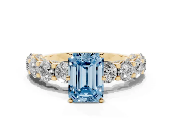 Fancy Blue Emerald Cut Diamond Side Stone Engagement Ring with Four-Prong Setting Yellow gold