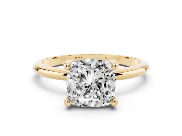 Cushion Cut Solitaire Diamond Ring with 4-Prong Setting on a Classic Band Yellow gold