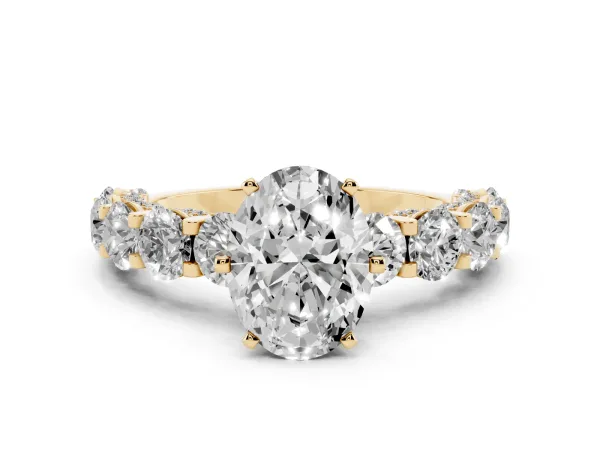 Oval Cut Diamond Side Stone Engagement Ring with Four-Prong Setting Yellow gold