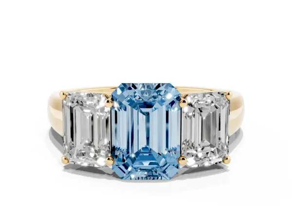 Fancy Blue Emerald Cut Three-Stone Diamond Ring with Prong Setting on a Classic Band Yellow gold
