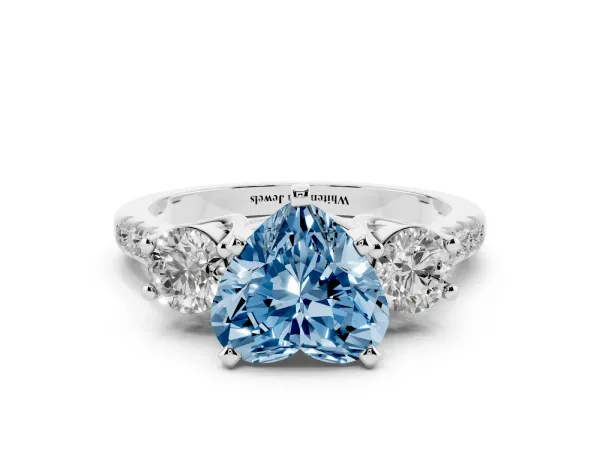 Fancy Blue Three-Stone Heart Cut Diamond Pavé Band with Four-Prong Setting Platinum