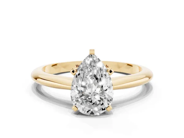 Pear Cut Cut Solitaire Ring with Four-Prong Setting on a Classic Band Yellow gold