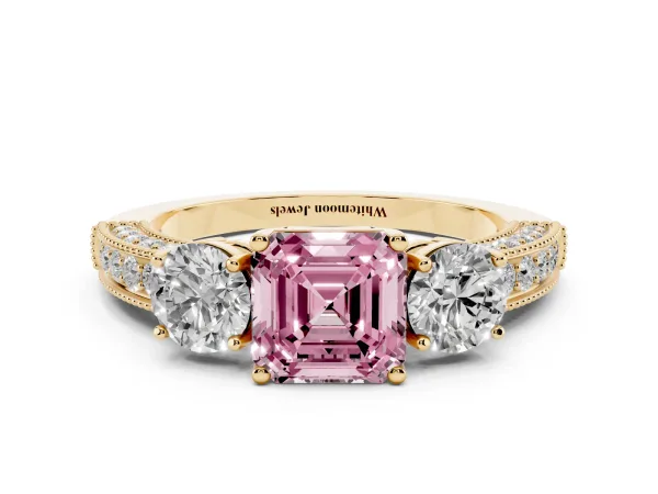 Fancy Pink Asscher Cut Three-Stone Diamond Ring with Pavé Band and Four-Prong Setting Yellow gold