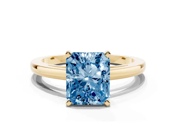 Fancy Blue Radiant Cut Solitaire Diamond Engagement Ring with Four-Prong Setting on a Classic Band Yellow gold