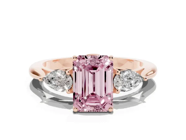 Fancy Pink Three-Stone Emerald Cut Diamond Ring with Pear Side Stones in Four-Prong Setting Rose gold