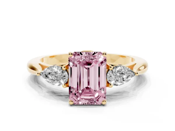 Fancy Pink Three-Stone Emerald Cut Brilliant Diamond Solitaire Ring with Tapered Band and Four-Prong Setting Yellow gold