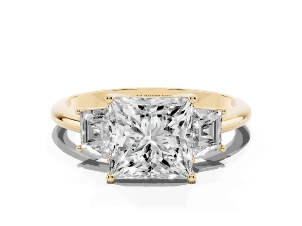 Princess Cut Diamond Three-Stone Ring with Trapezoid Side Stones and Prong Setting Yellow gold