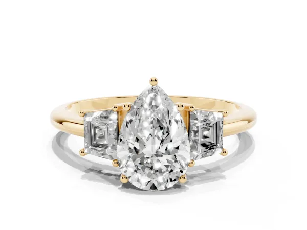 Pear Cut Diamond Three-Stone Ring with Trapezoid Side Stones and Prong Setting Yellow gold