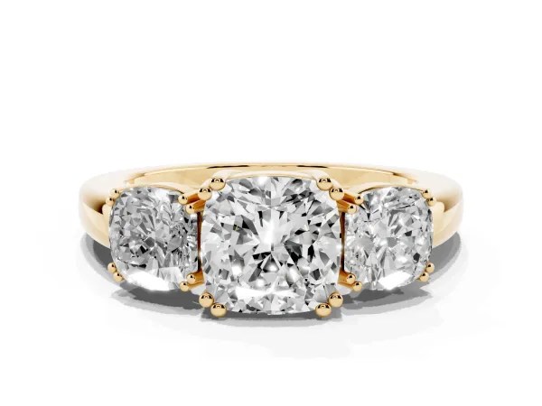 Three-Stone Cushion Cut Cut Diamond Ring with Channel Set Band and Four-Prong Setting Yellow gold