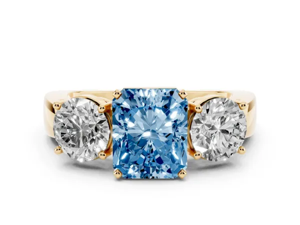 Fancy Blue Three-Stone Radiant Cut Diamond Ring with Round Side Stones, Classic Band, and Four-Prong Setting Yellow gold