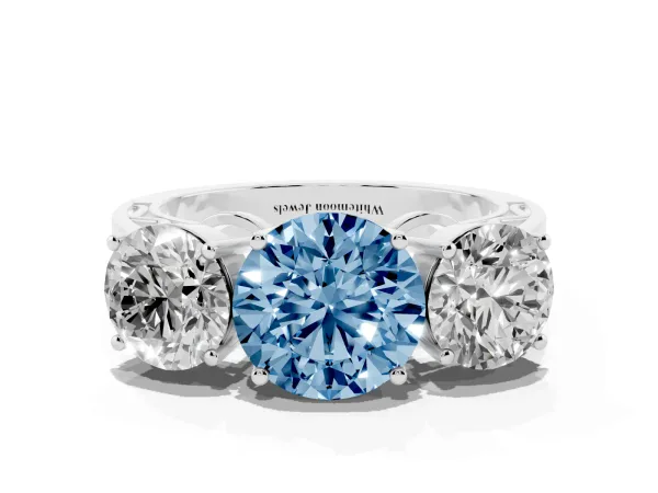 Fancy Blue Round Cut Diamond Three-Stone Ring with Prong Setting and Textured Band Platinum